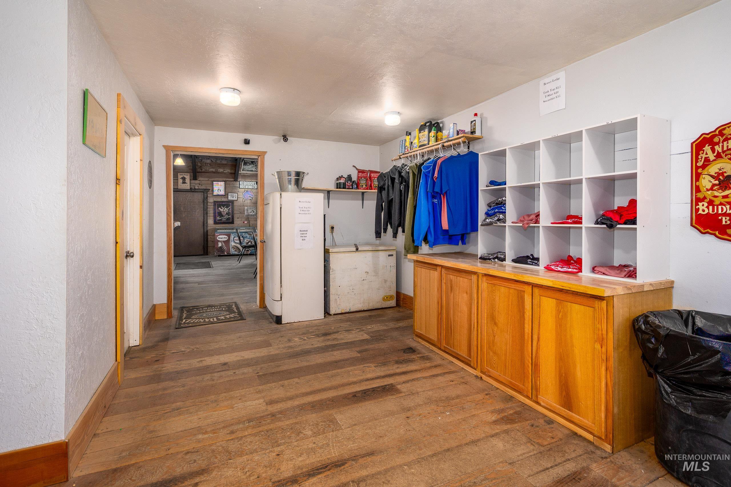 Spacious closet with dark wood finished floors