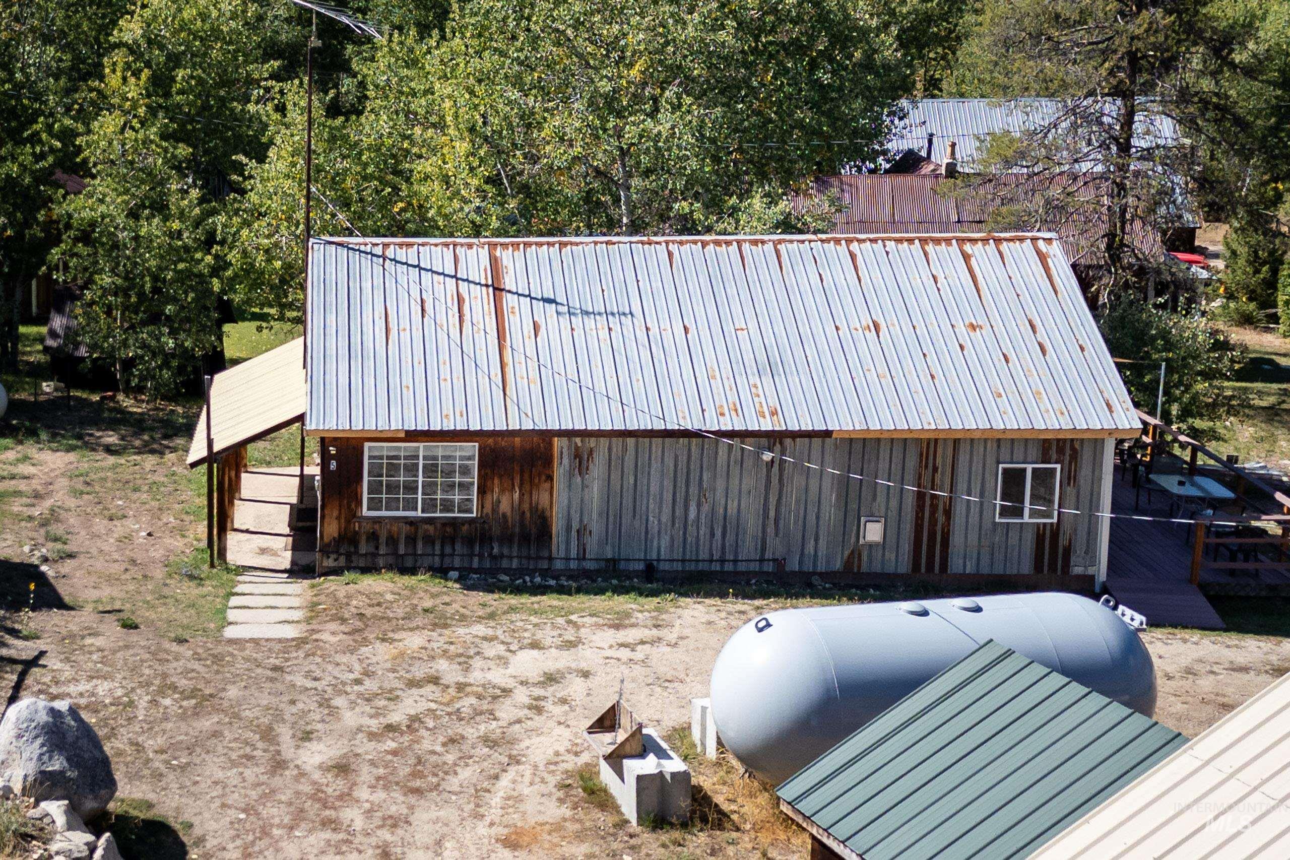 View of property exterior with a metal roof