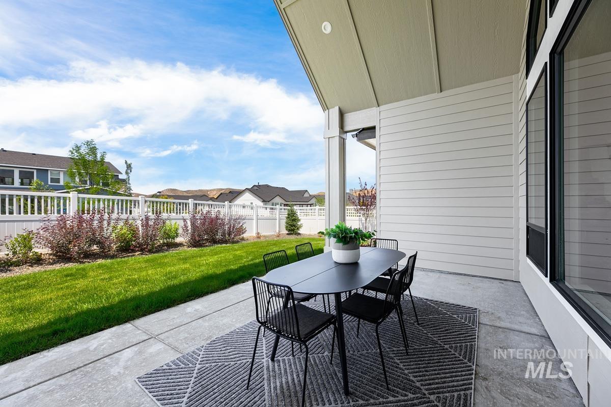 View of patio with outdoor dining area and a residential view