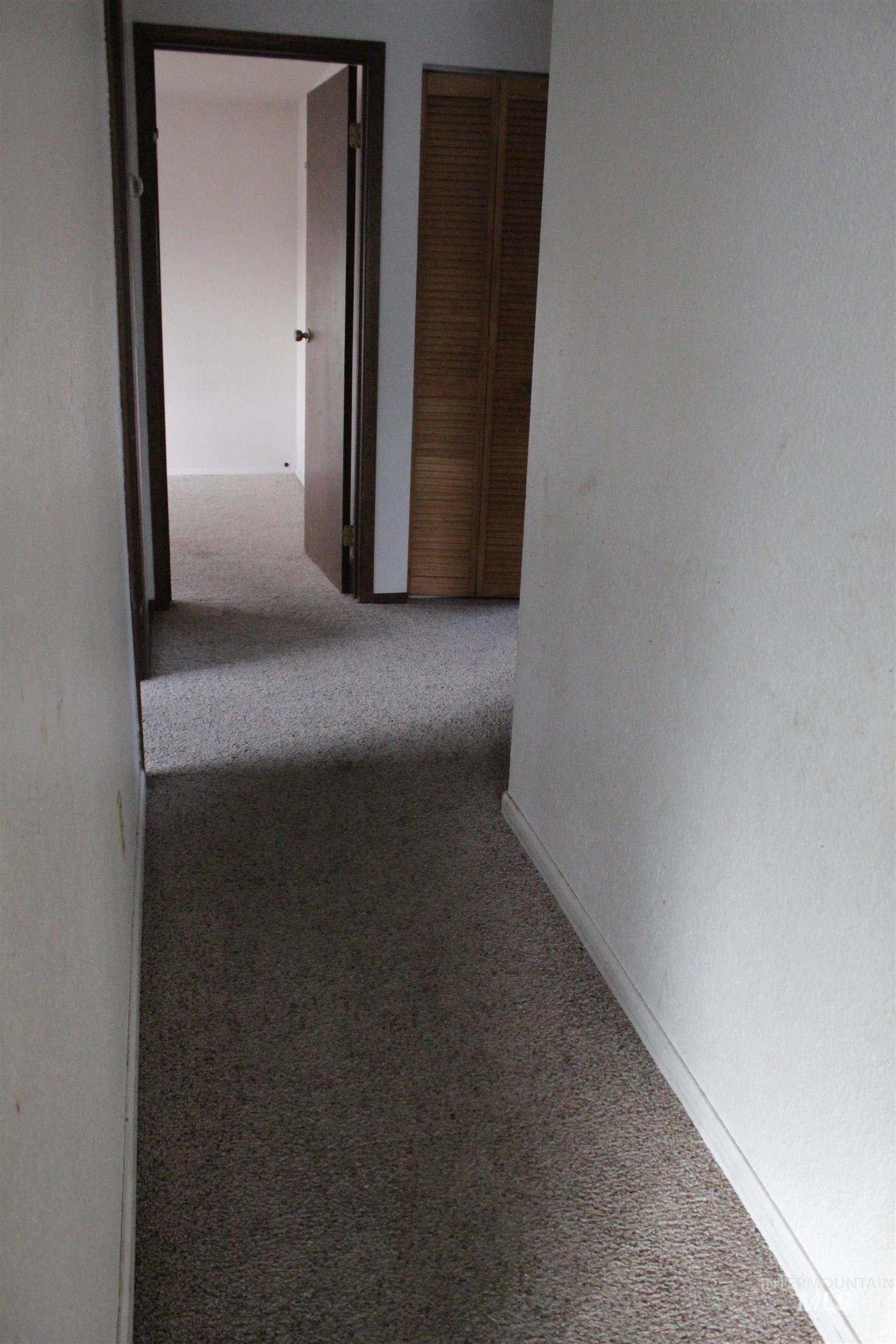 Hall featuring carpet