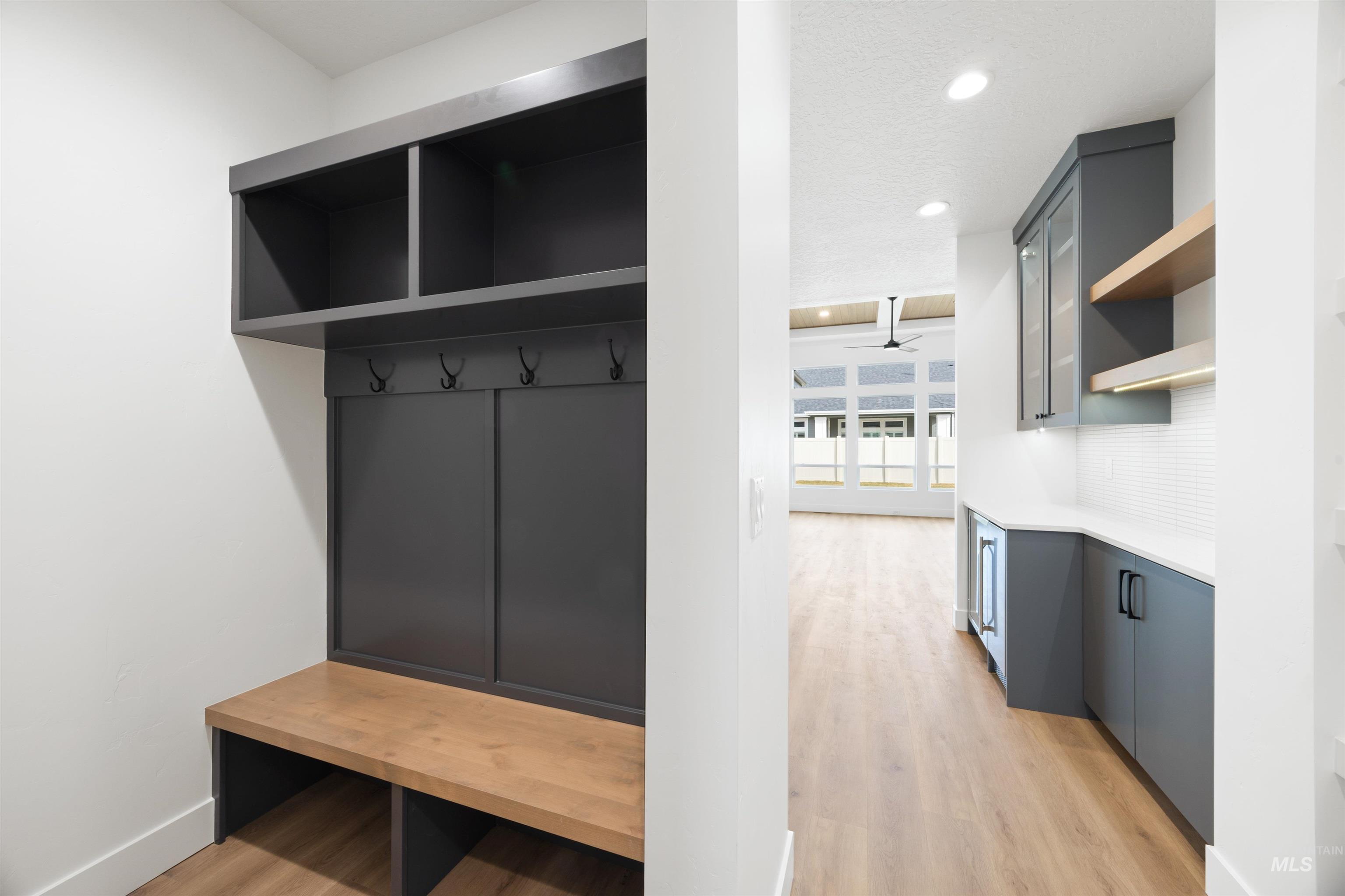 Mudroom with light wood-type flooring and recessed lighting