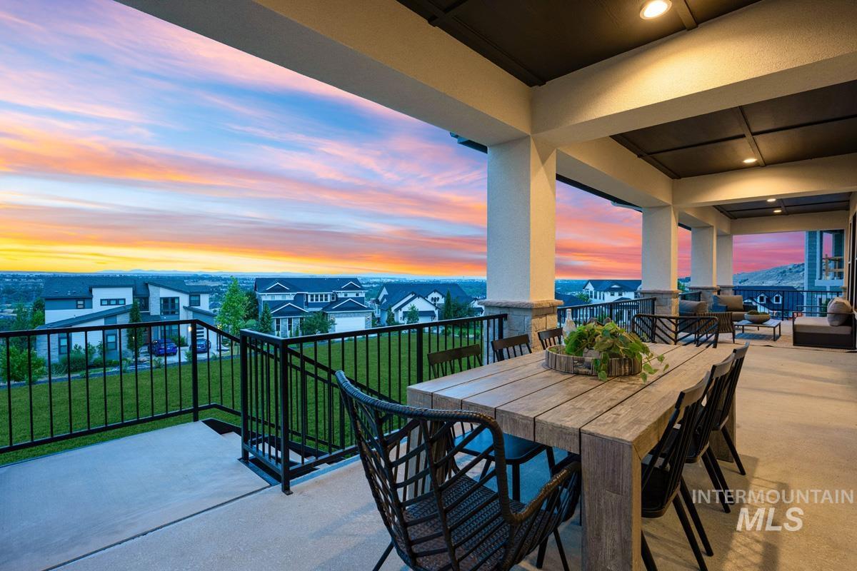 Expansive covered patio featuring concrete flooring, substantial structural columns, and recessed lighting