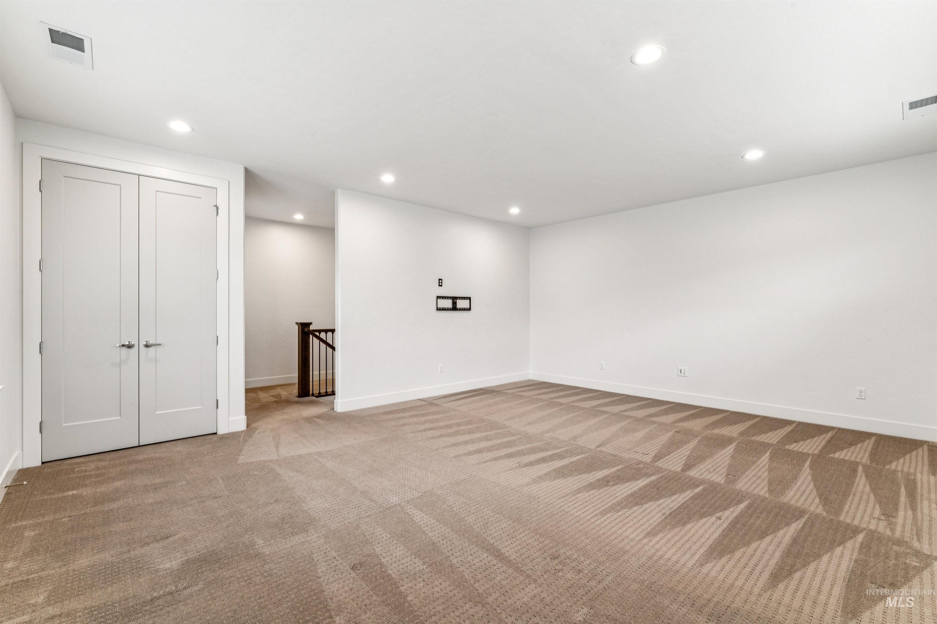 Bonus room featuring healthy amount of natural light, recessed lighting and closet for optional 4th bedroom - easily add a barn door.