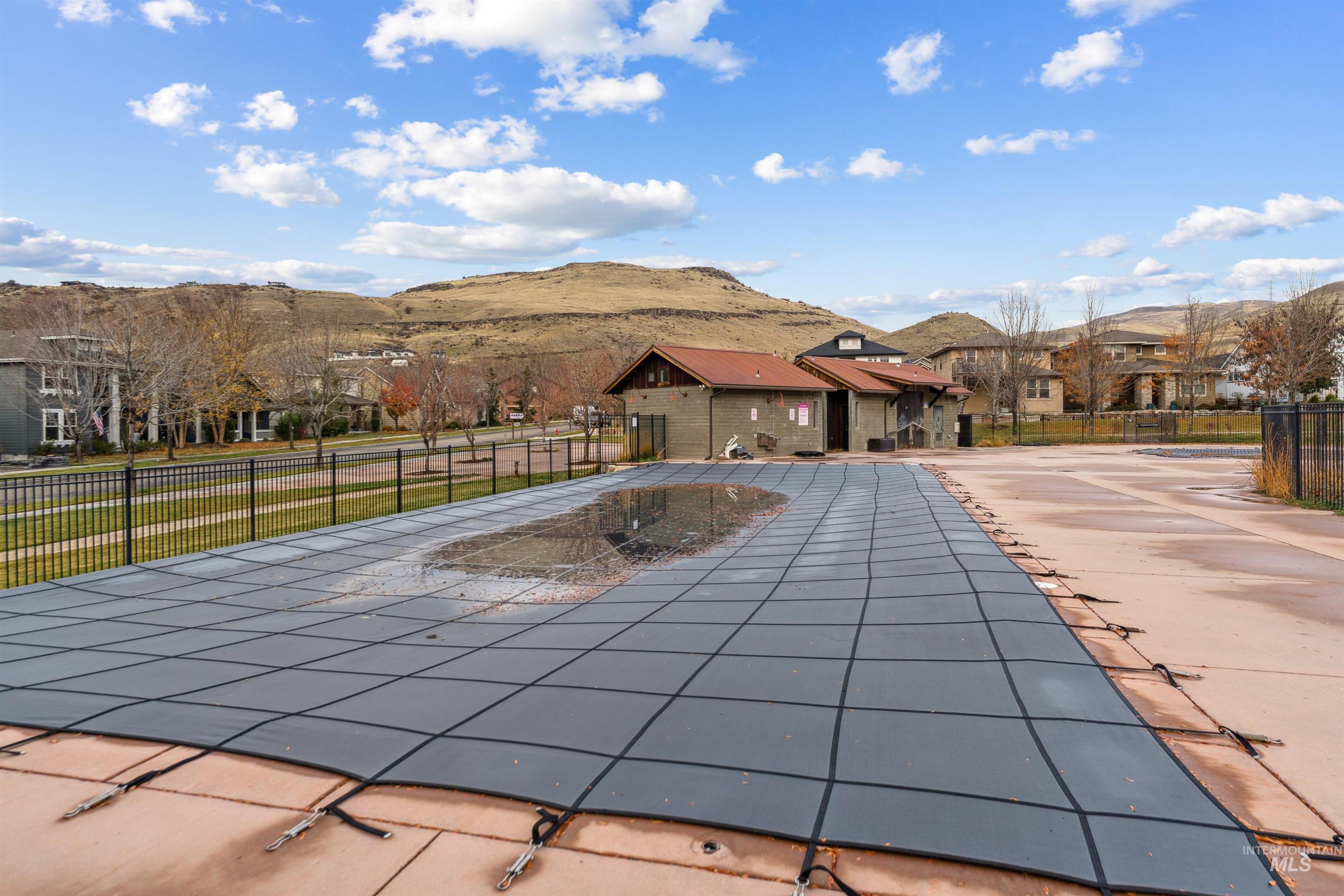 Community pool with a mountain view