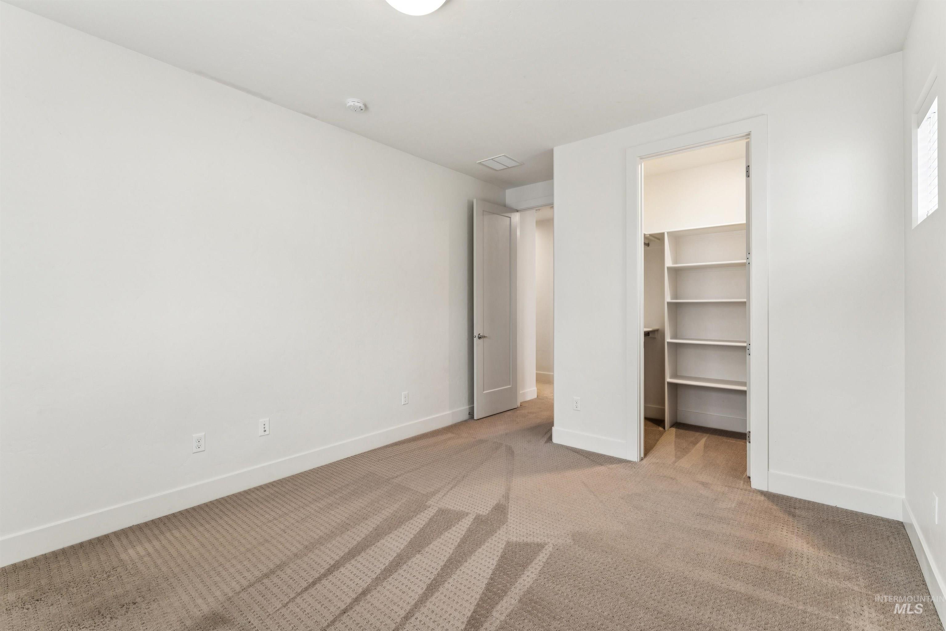 Bedroom with a spacious walk-in closet