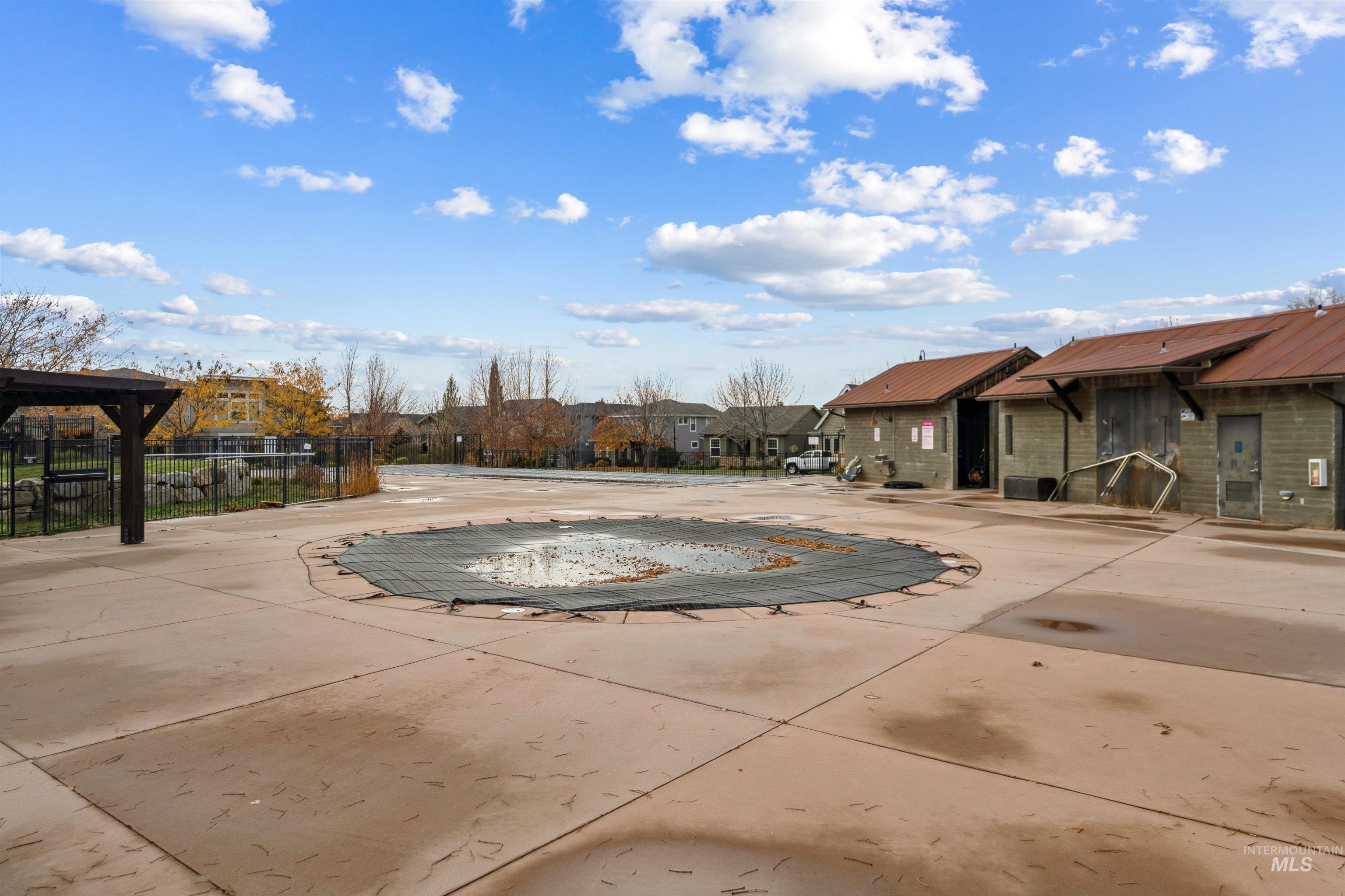 View of pool featuring a residential view and a patio
