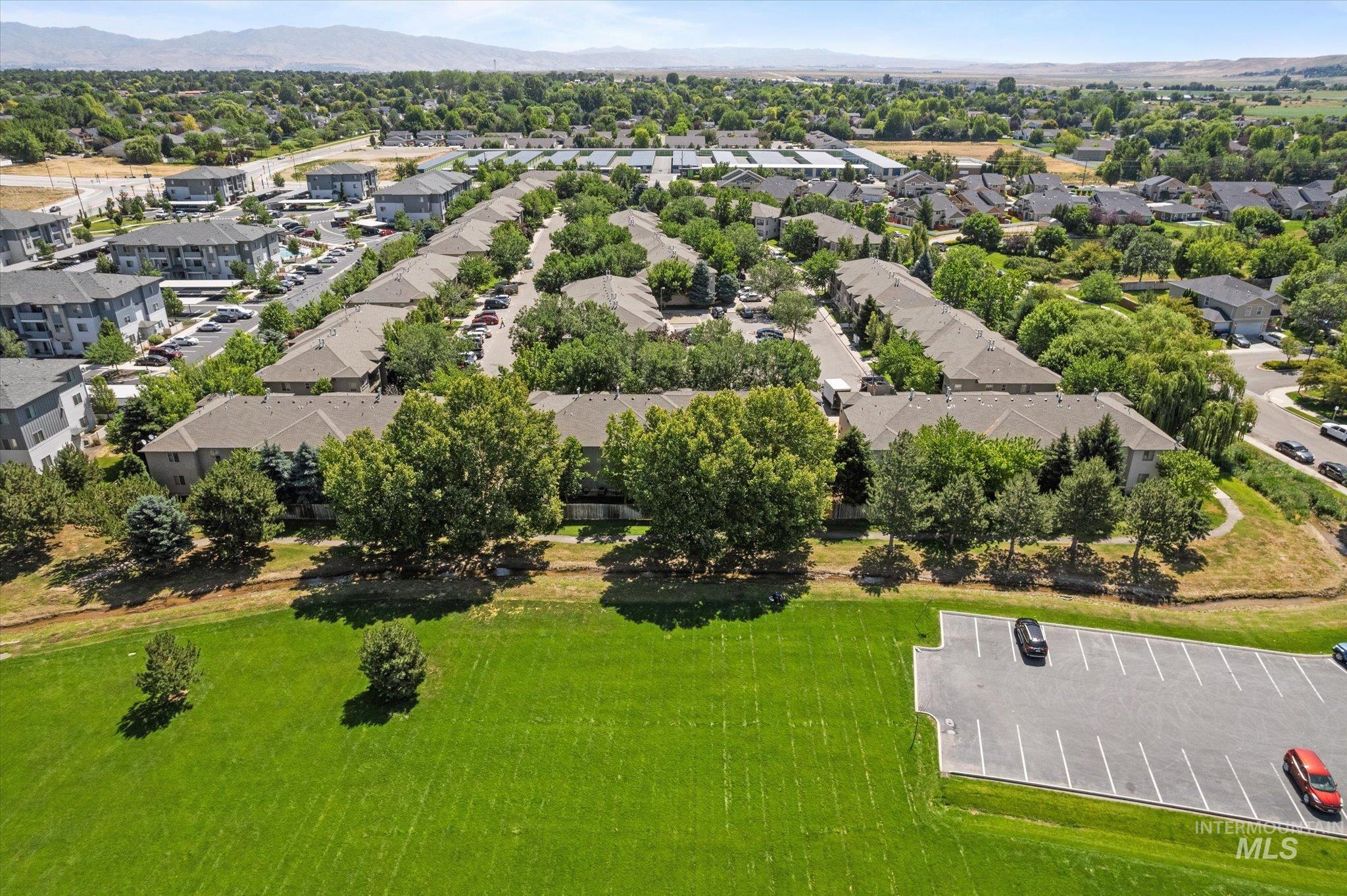 Aerial view of residential area featuring a mountain backdrop