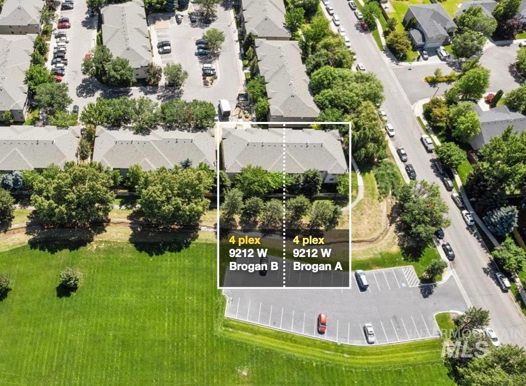 Aerial perspective of suburban area featuring a large body of water