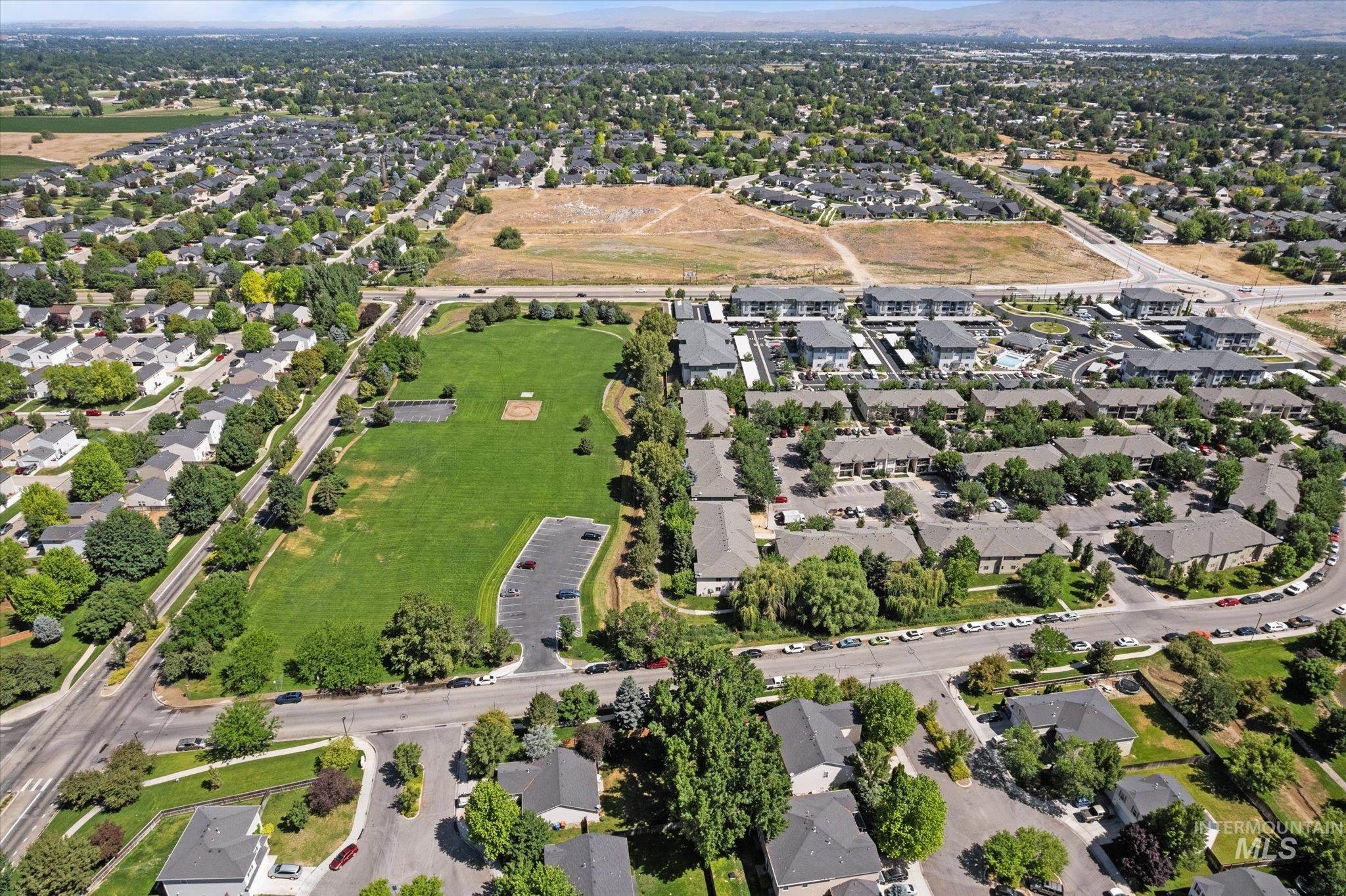 Aerial view of property's location featuring nearby suburban area