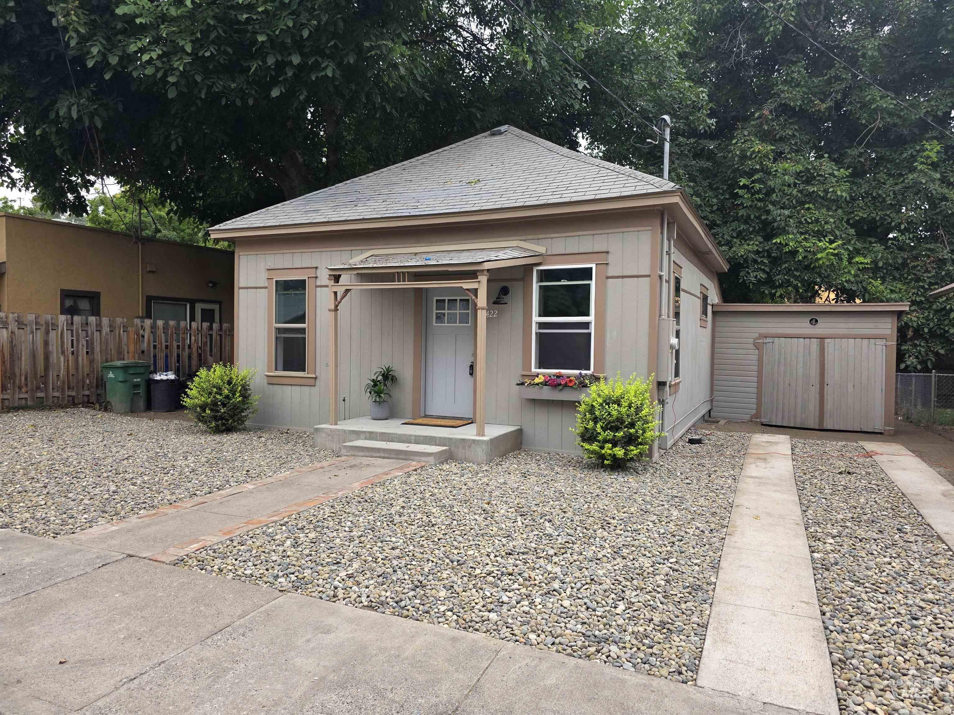 Bungalow featuring a shingled roof