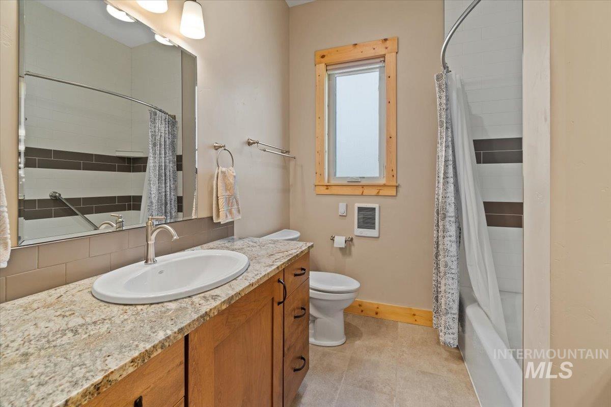 Full bathroom with vanity and shower / bath combo