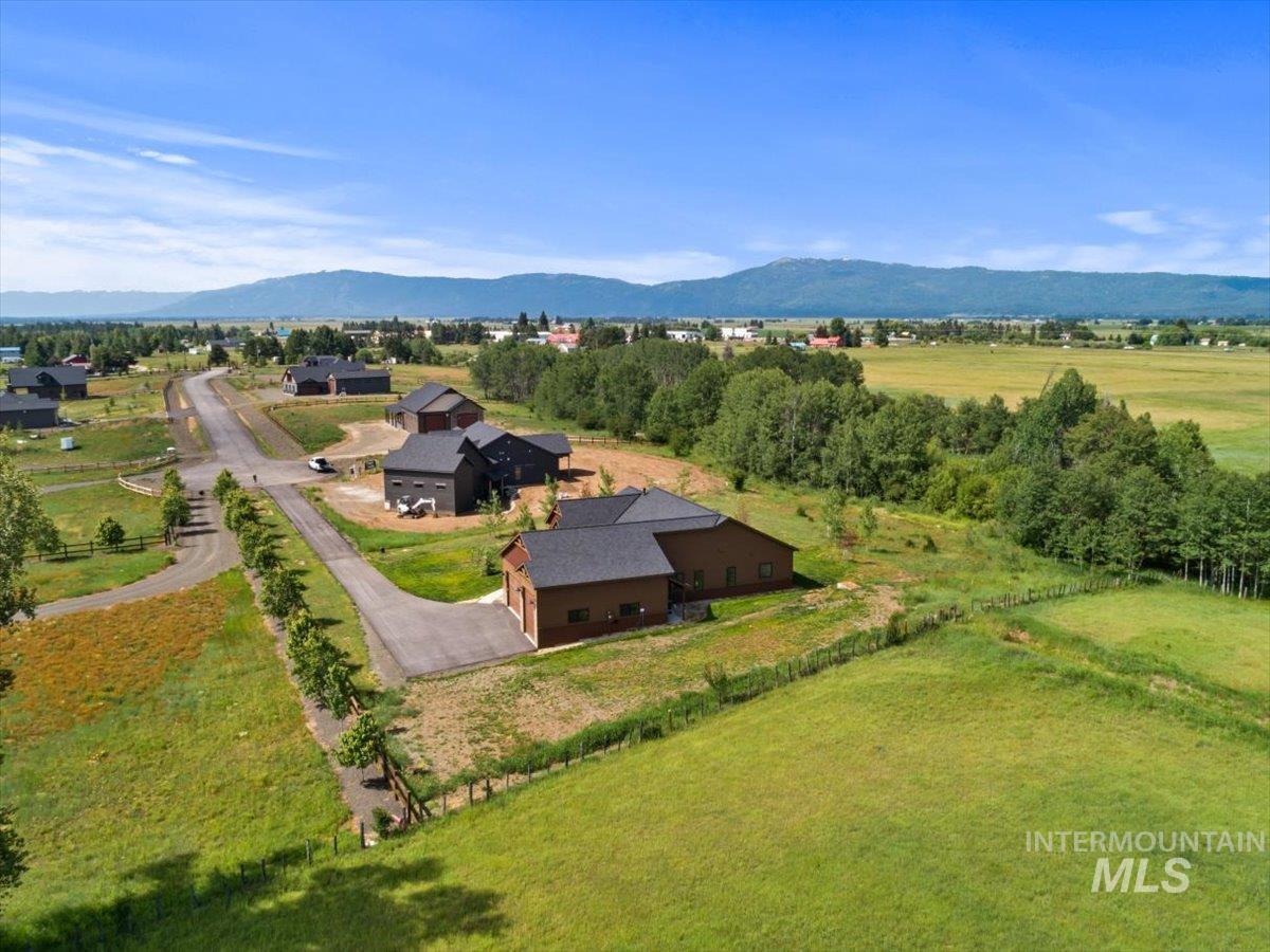 View from above of property with a mountain backdrop