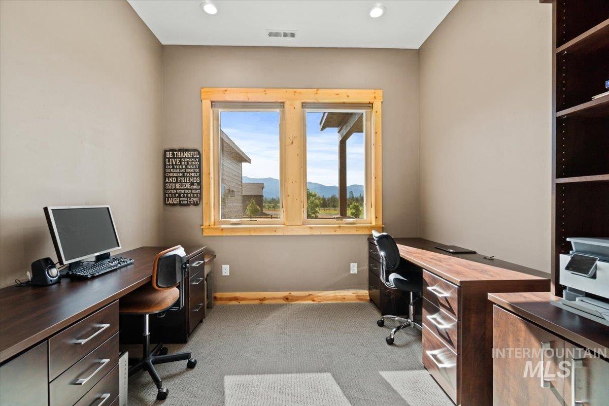 Home office with carpet and recessed lighting
