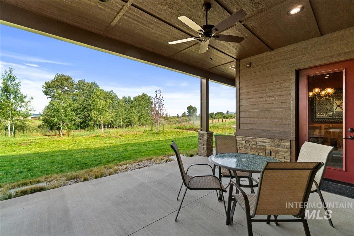 View of patio / terrace with ceiling fan and outdoor dining area