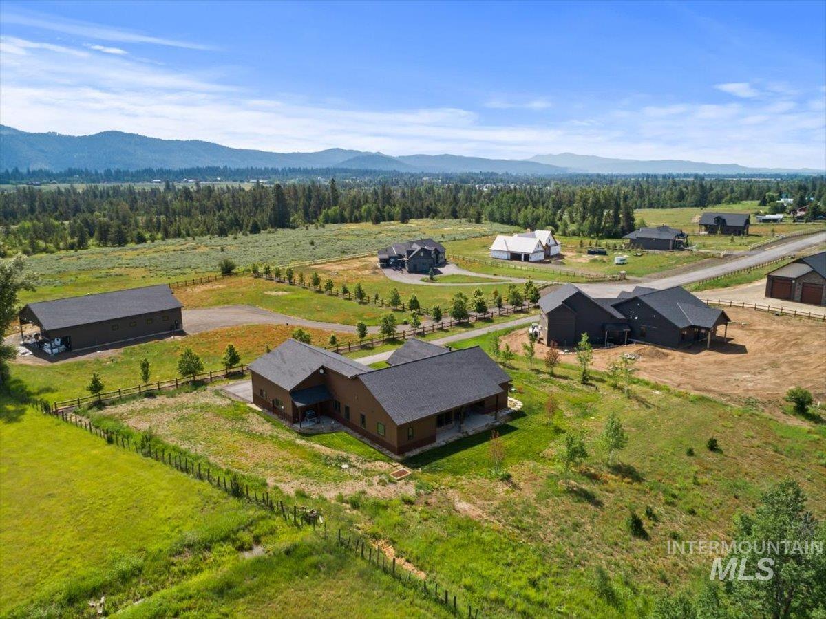 Aerial view of sparsely populated area with a mountainous background