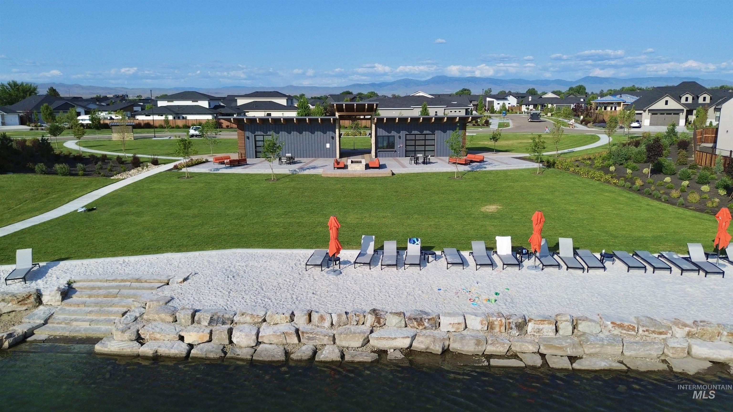 Surrounding community featuring a residential view, a patio area, and a lawn