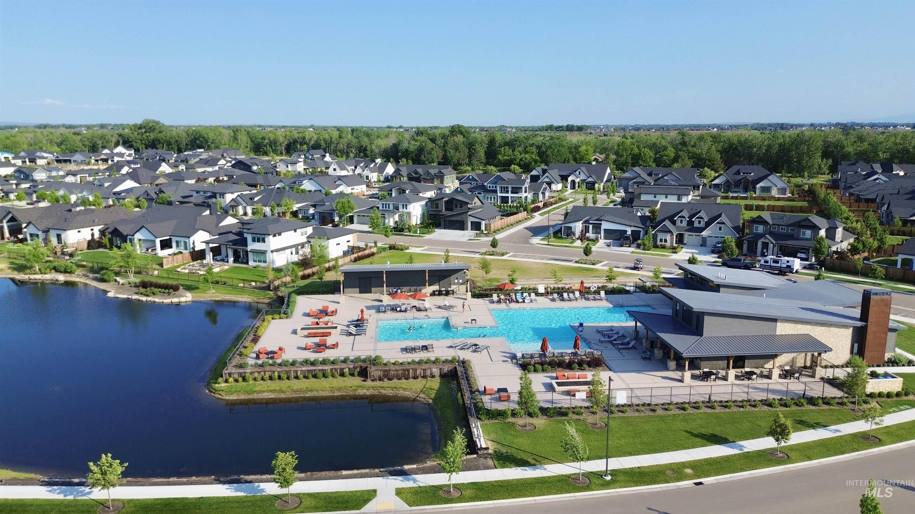 Aerial perspective of suburban area with a pool