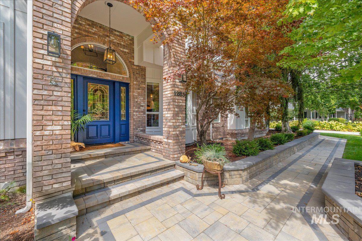 Property entrance featuring brick siding