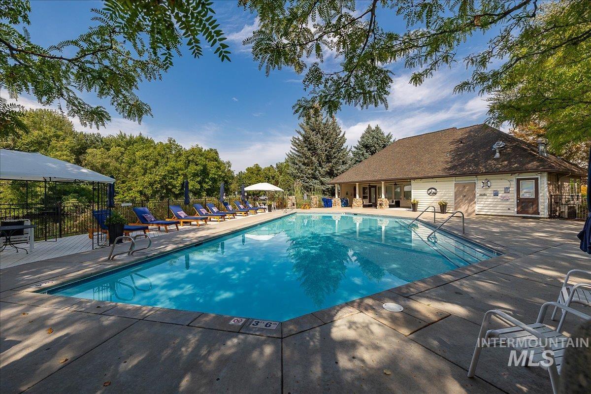 Community pool featuring a patio