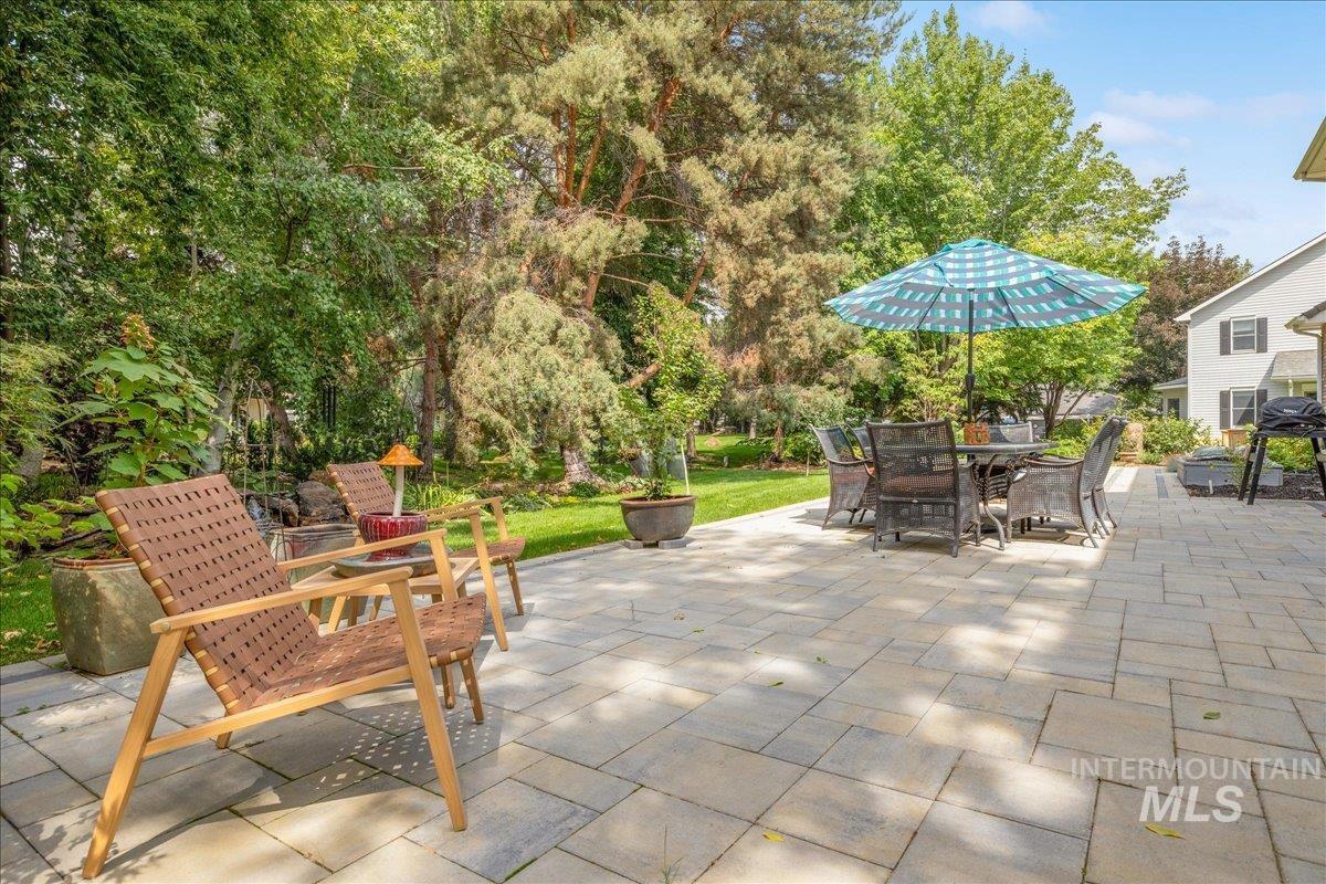 View of patio / terrace featuring outdoor dining area and a grill