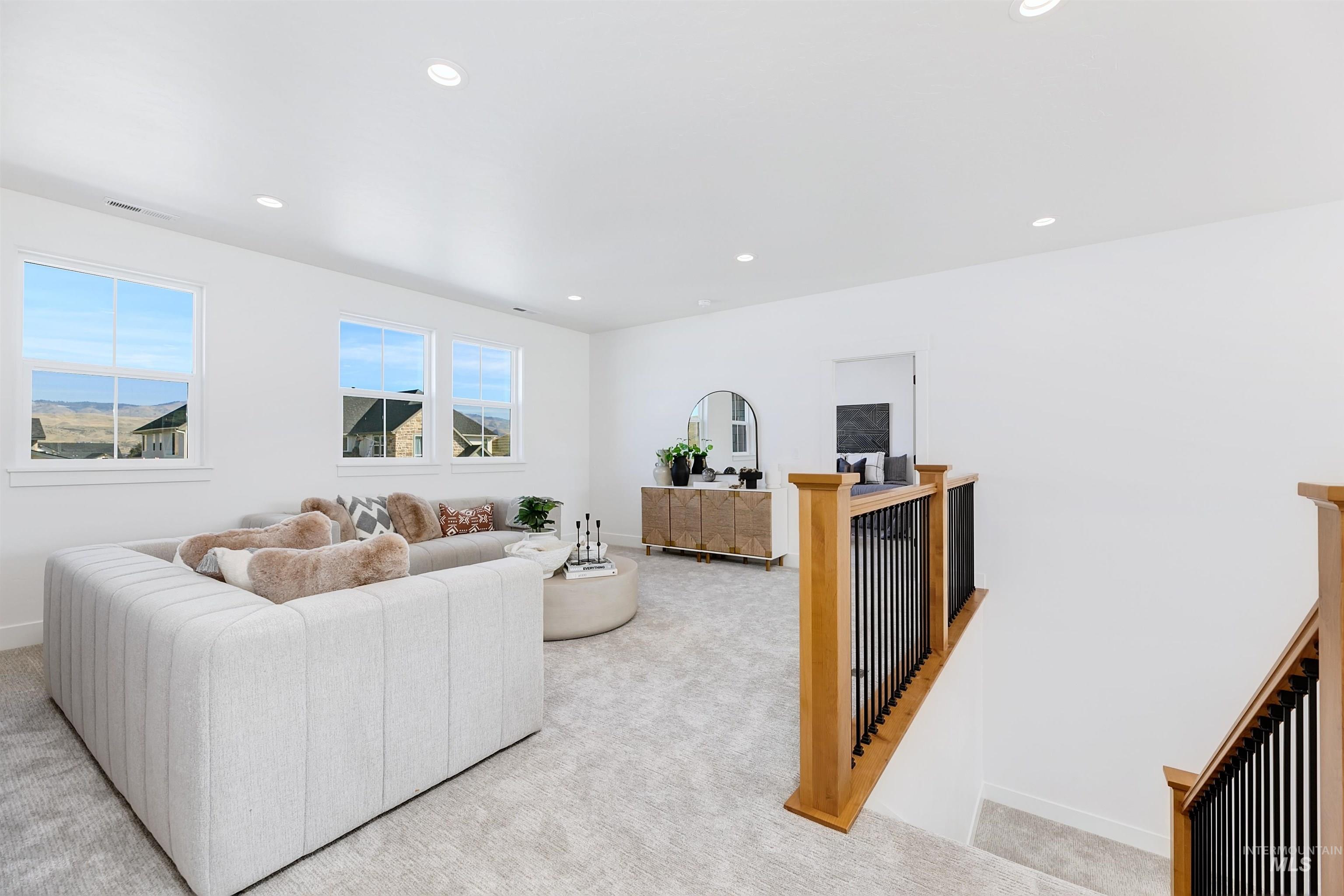 Living room featuring carpet flooring and recessed lighting