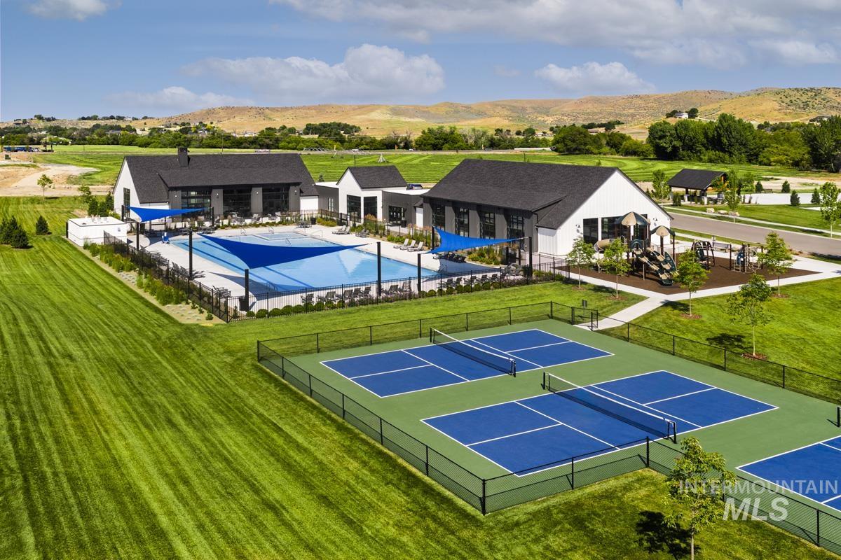 Aerial view of a pool area and a mountain backdrop