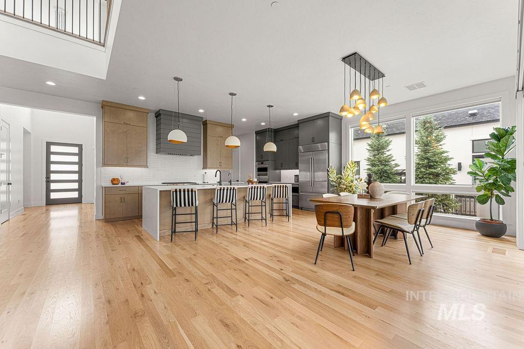 Open-concept living space featuring wood-finish flooring throughout