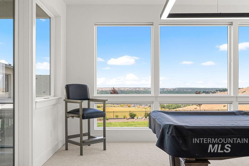 Expansive floor-to-ceiling windows with white trim