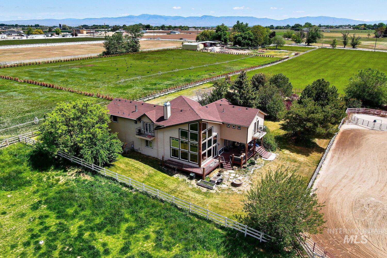 View of rural area featuring agricultural land and a mountain backdrop