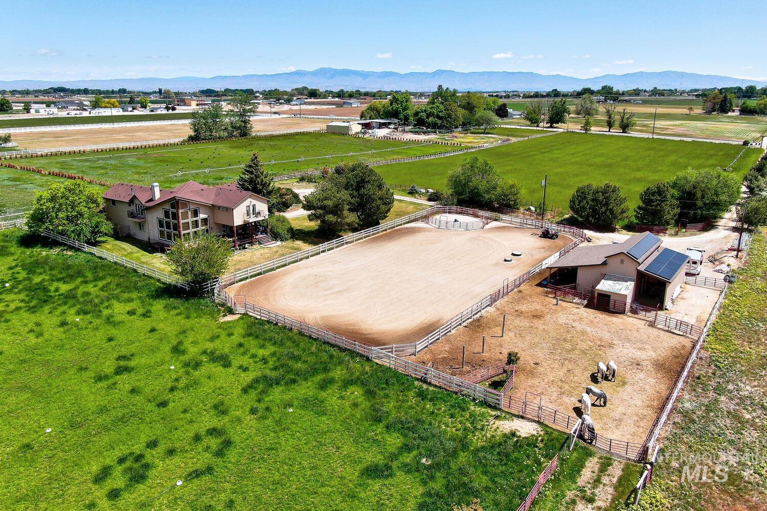 Overview of rural landscape featuring a mountainous background