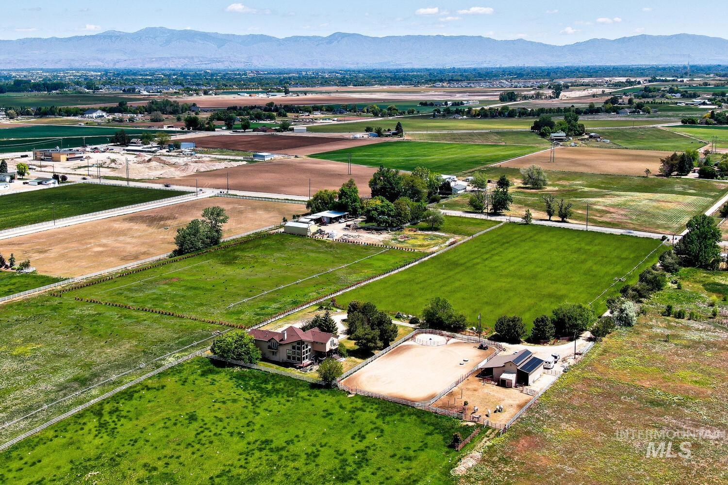 Aerial view of sparsely populated area featuring a mountainous background