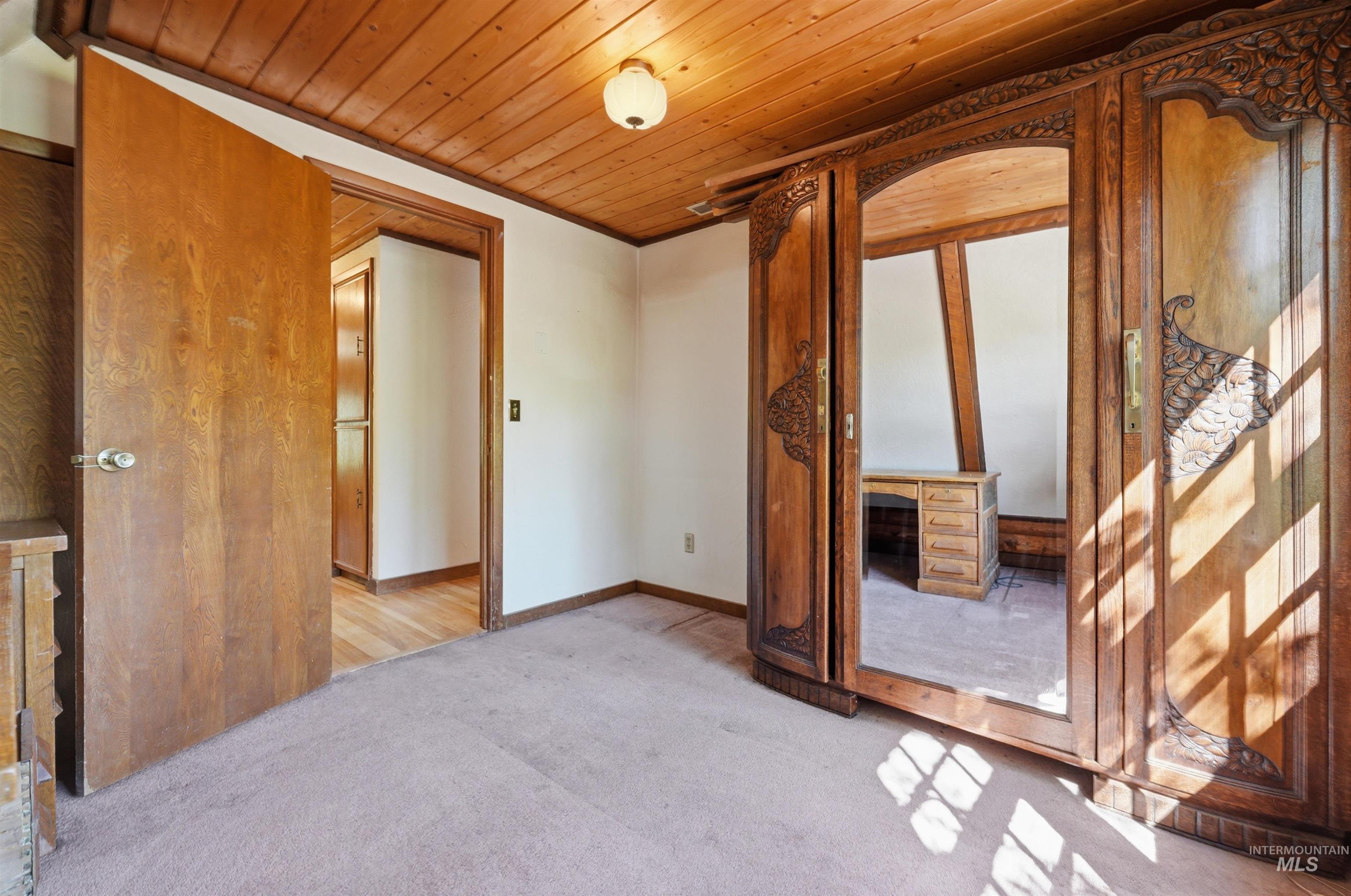 Wood-paneled ceiling with an integrated light fixture