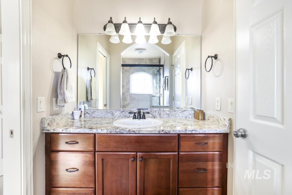 Full bath featuring vanity and a stall shower