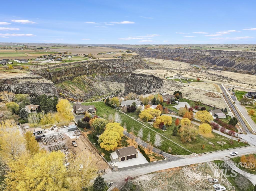 Aerial view of property and surrounding area with rural landscape