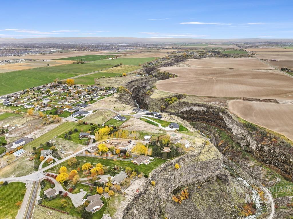 Aerial view of property and surrounding area with rural landscape