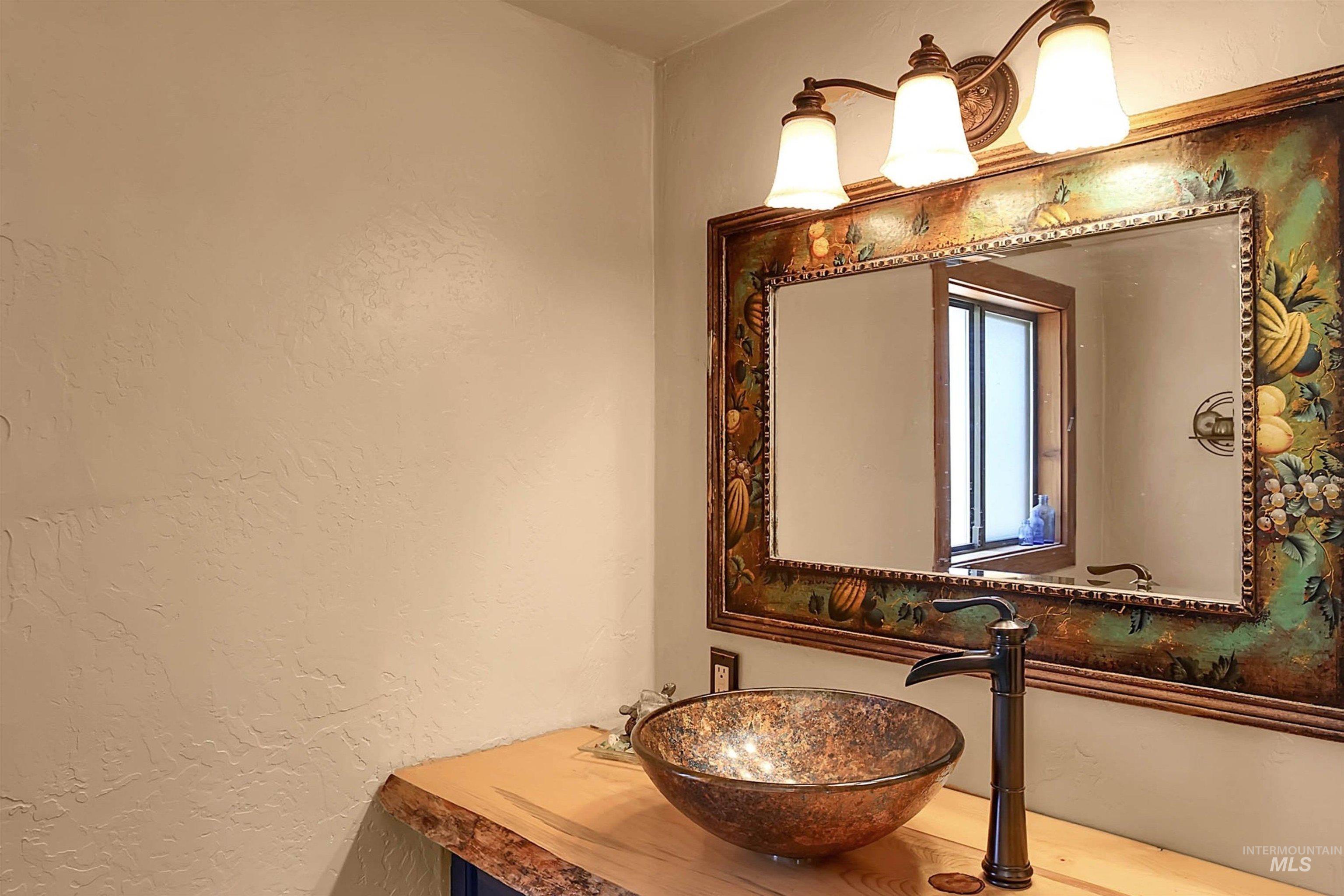 Bathroom with a textured wall and a sink