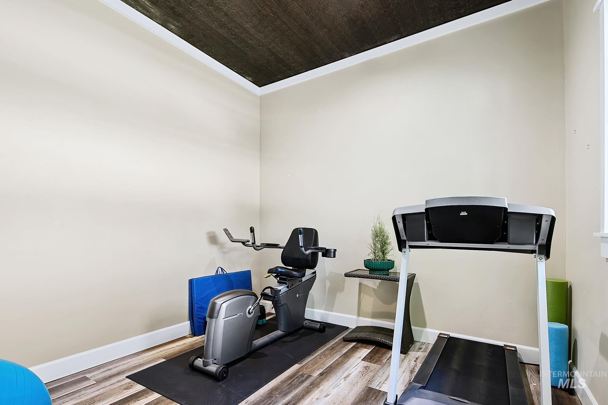 Versatile flex space off the primary suite, ideal for a home gym, yoga studio, or private retreat