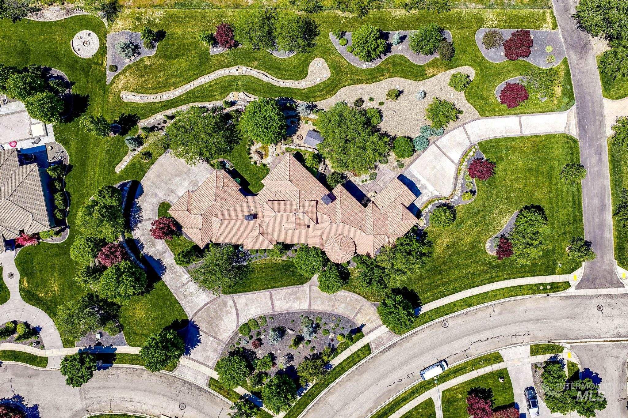 Aerial view showcasing the lush 1.8 acre property