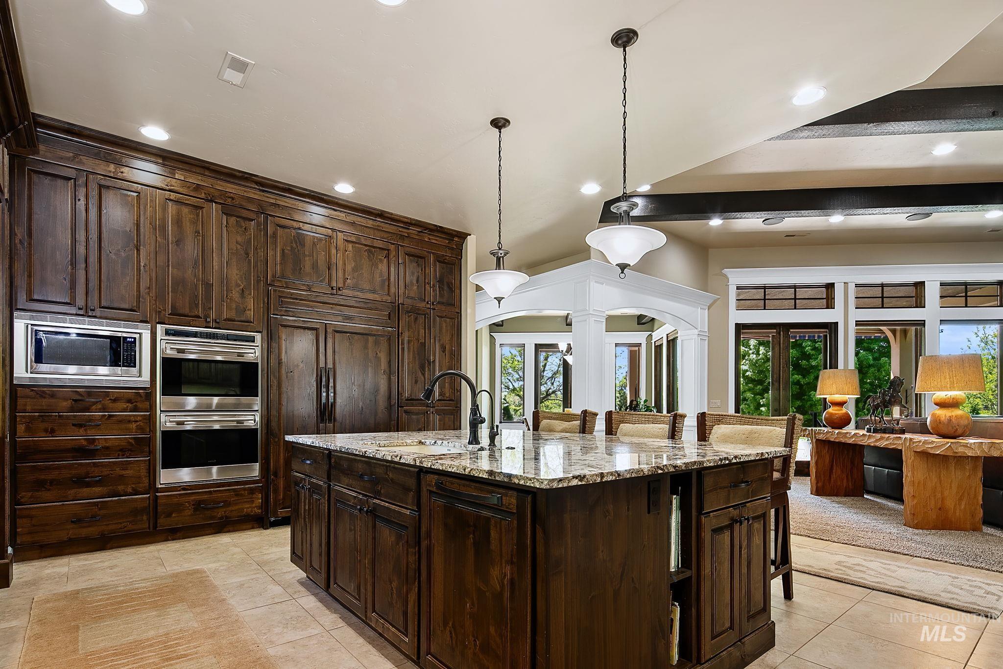 Beautifully appointed chef?s kitchen offering abundant storage, premium finishes, and elevated rustic elegance