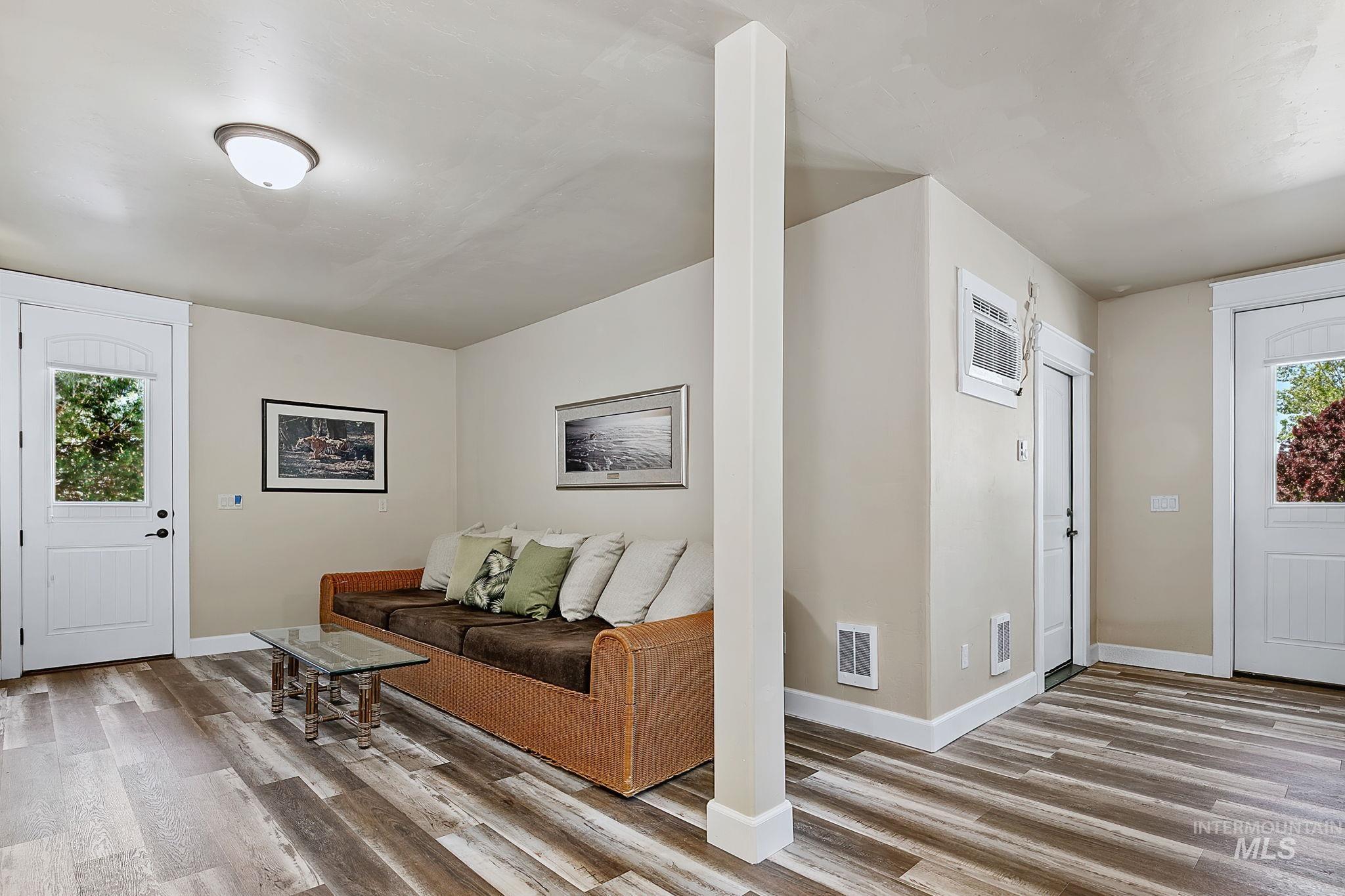 Private apartment-style ADU featuring its own separate entrance, spacious living area, durable LVP flooring, and flexible space ideal for guests or multi-generational living