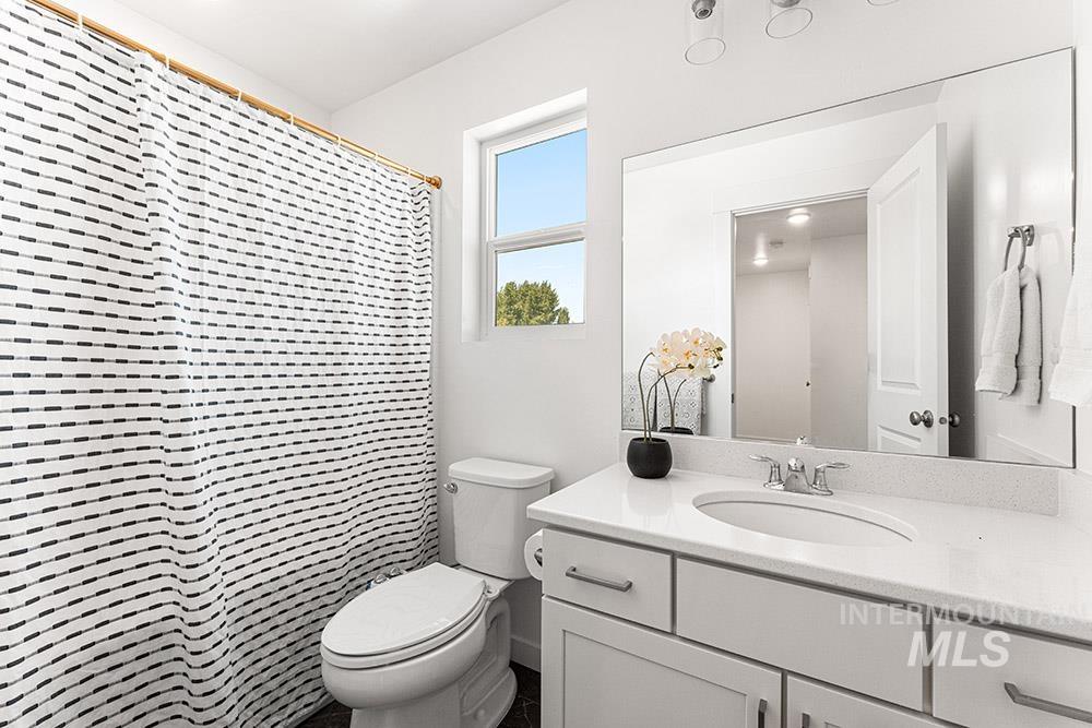 Bathroom with vanity and a shower with curtain