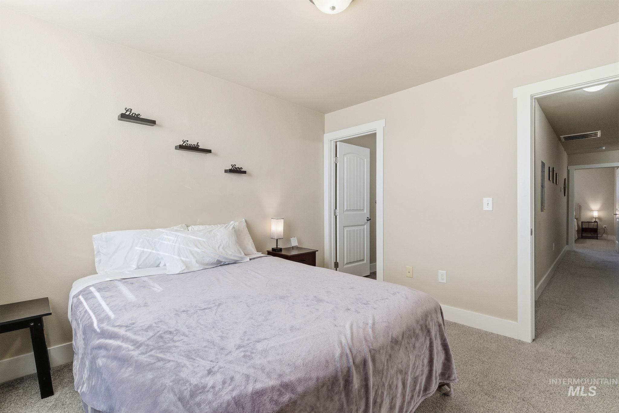 Bedroom with light carpet