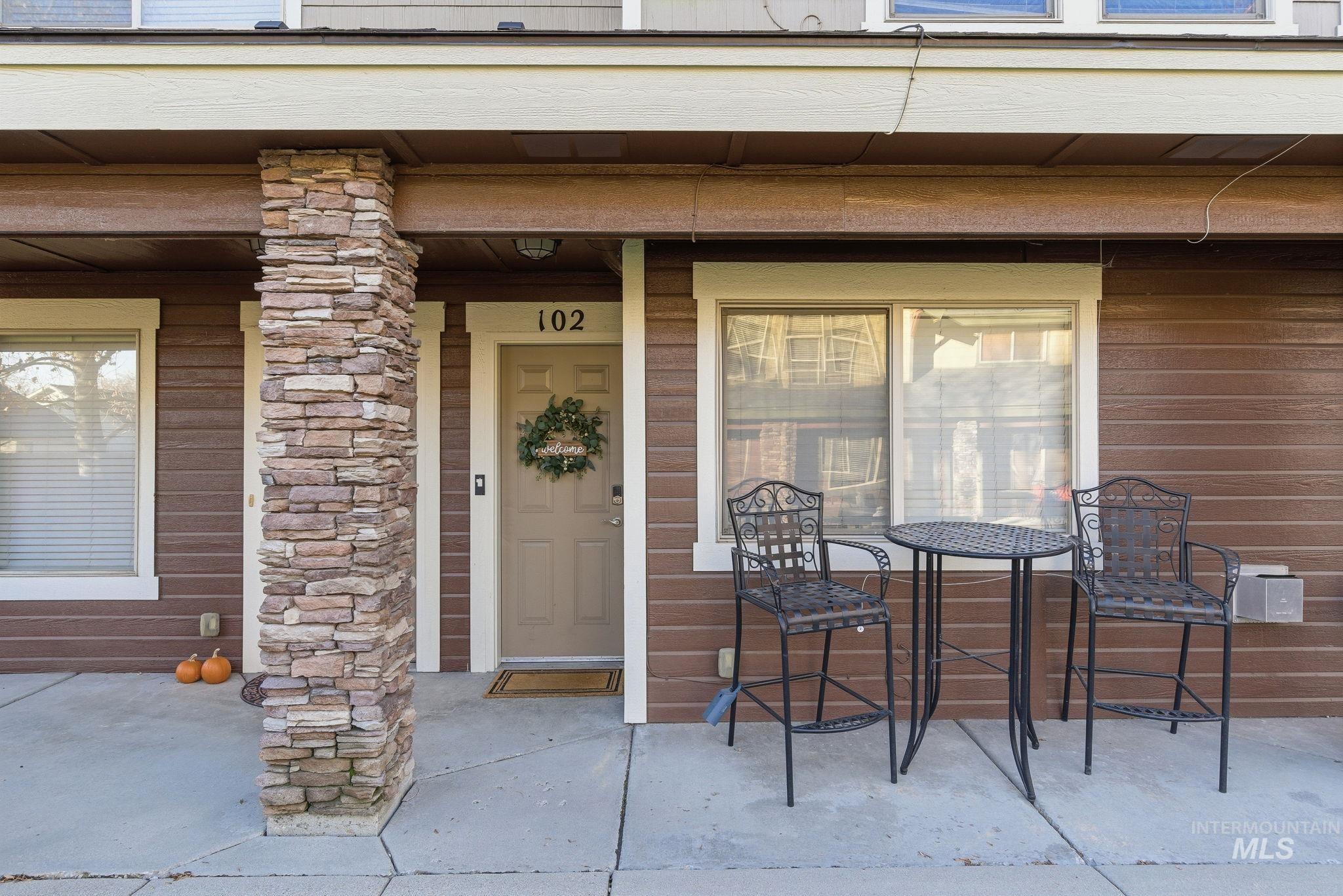 Doorway to property with covered porch