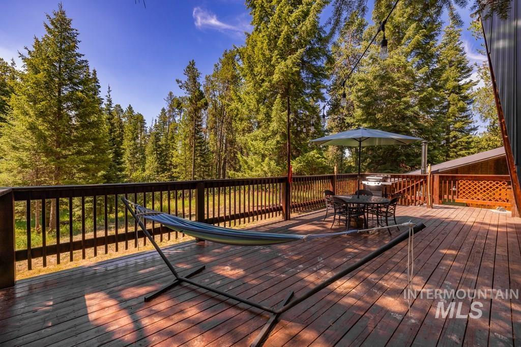 Wooden deck featuring outdoor dining space