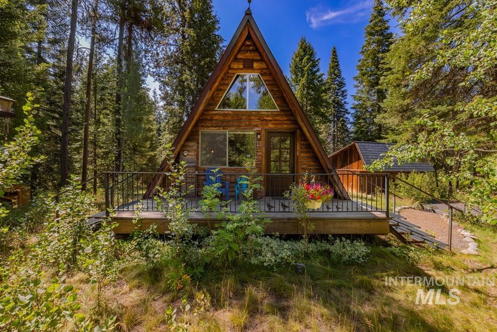 Rear view of property with a wooden deck