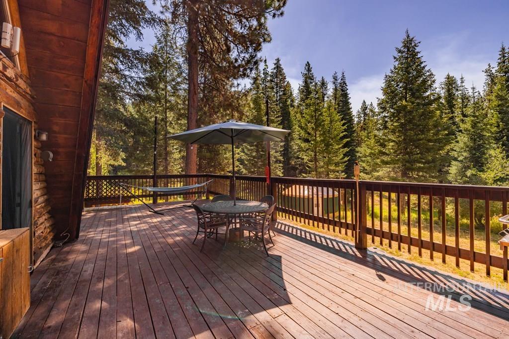Wooden deck featuring outdoor dining area