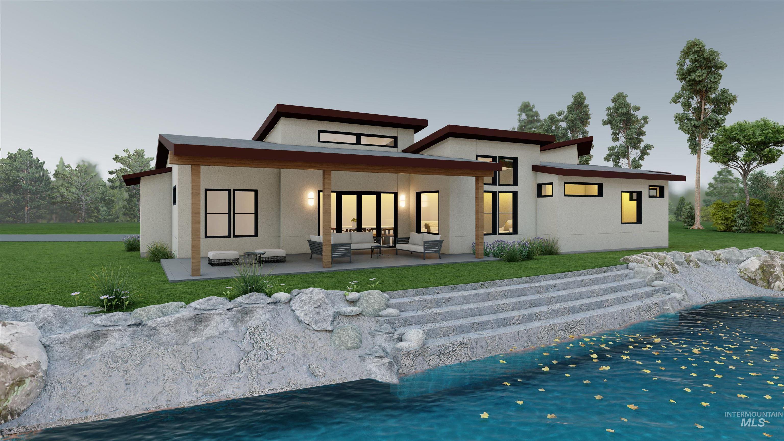 Back of property featuring an outdoor hangout area, a yard, a covered patio area, stucco siding, sandy beach