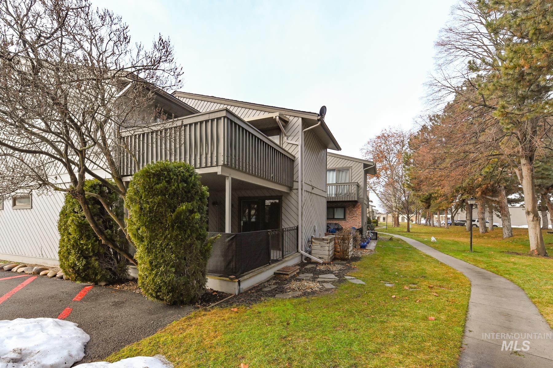 View of property exterior featuring a yard