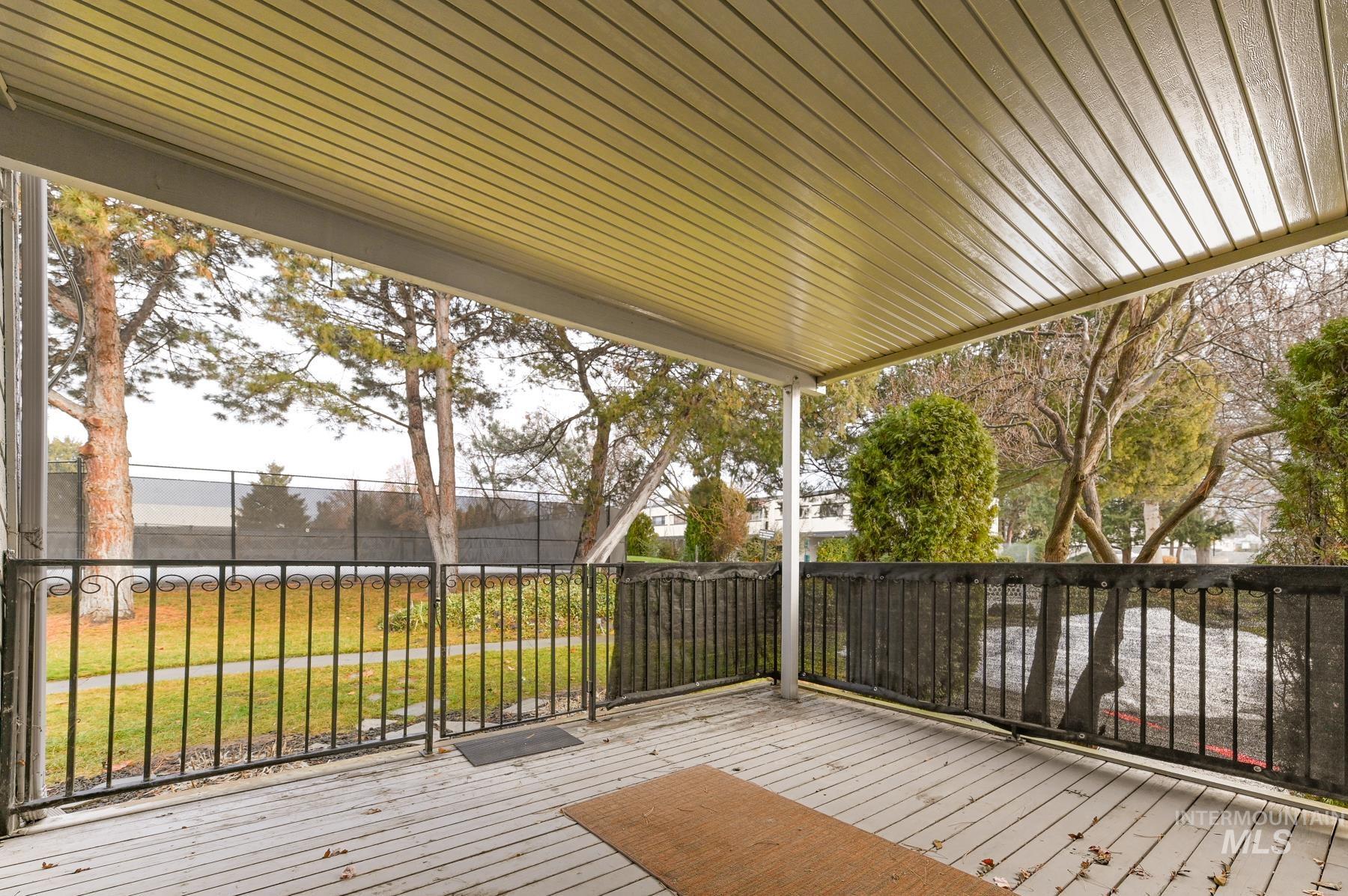 Wooden deck featuring a lawn