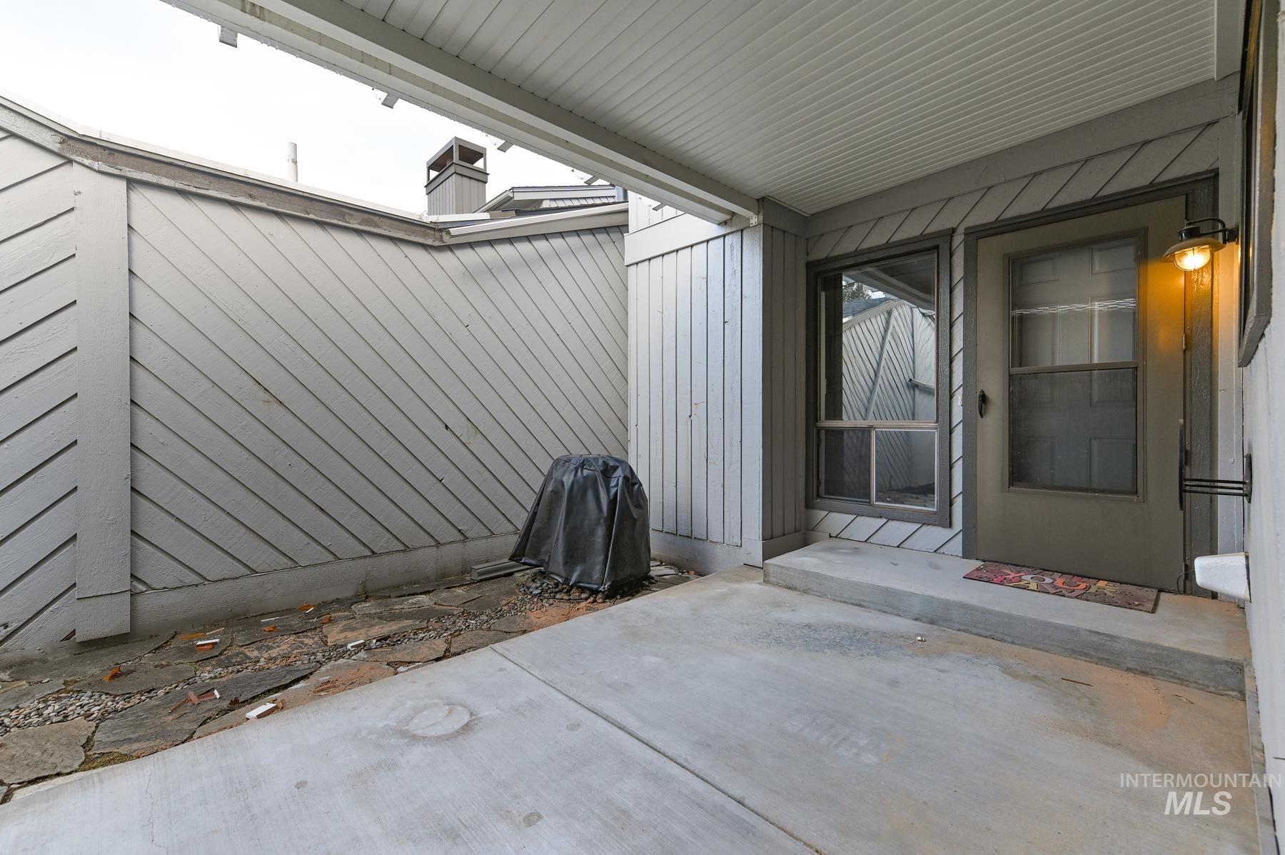 Property entrance featuring a patio area